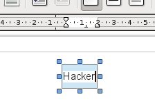 Haz doble clic sobre el rectángulo. Mira que el cursor se posiciona en el centro. Escribe Hacker en él.