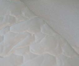 CONTRACT PROTECTORES DE COLCHÓN PROTECTOR DE COLCHÓN PVC - RIZO 100 % algodón con las esquinas elásticas adaptables a camas de 190 y 200 cm de largo. Base impermeable de PVC. No transpirable.