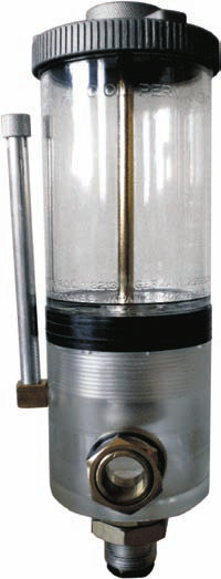 La inferior muestra e nive de aceite en a máquina por un efecto de vasos comunicantes y a superior es un depósito de reserva que va aportando a cantidad consumida a a zona inferior.