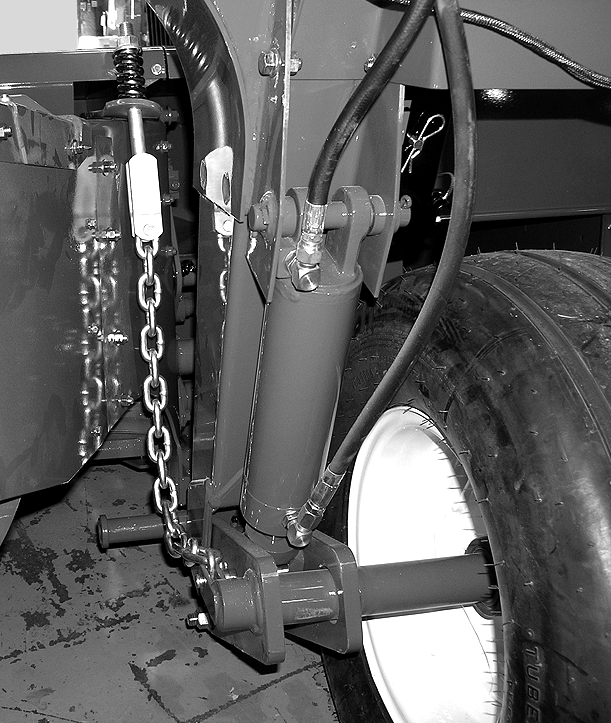 Instalación FIG. 67: Coloque el extremo de base del cilindro de levantamiento () en su posición e instale el pasador de horquilla. Instale la chaveta en el pasador de horquilla.