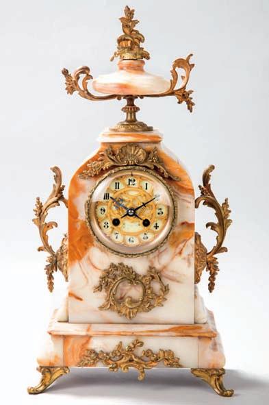 479 480 479 Reloj de sobremesa francés de ónix y bronce, ff. siglo XIX.