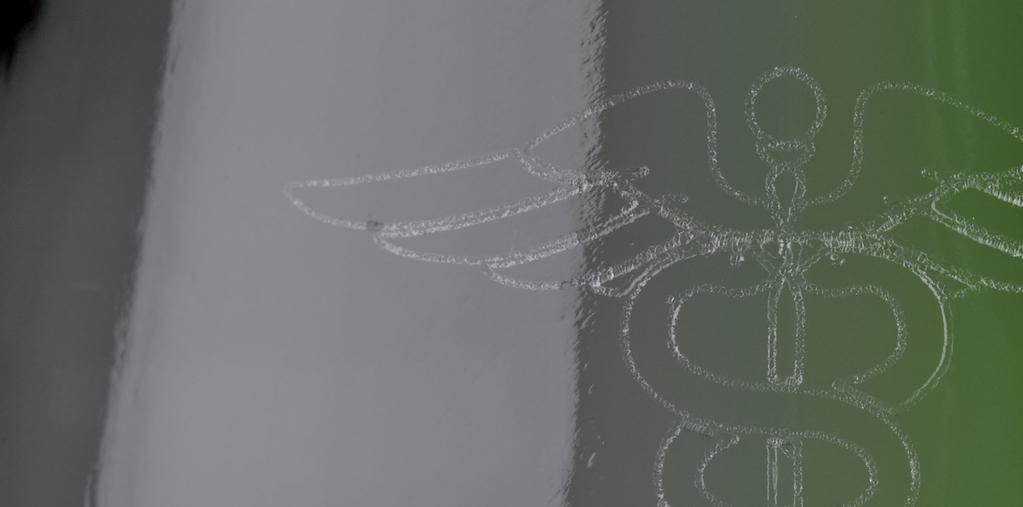 Detalle de un logotipo en vidrio Efectos de marcado: Grietas/fracturas diminutas que se graban en l a superficie del vidrio.