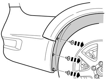 17 Aparte el revestimiento del paso de rueda y quite el tornillo de ambos lados del borde superior de la cubierta del parachoques.