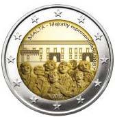 A la derecha aparece la «fleurette» (distintivo del taller de grabado). En la corona circular de la moneda figuran las doce estrellas de la Unión Europea.