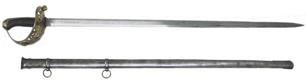 Espada de montar, modelo para Guardias de S.M. la Reina. Hoja (945 x 28 mm) inscrita anverso/reverso REAL CUERPO DE GUARDIAS DE S.M. LA REINA / ARTILLERÍA, FABRICA DE TOLEDO 1852.