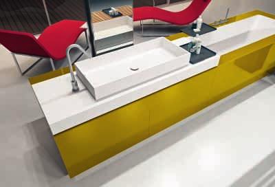 On the side: Surface washbasins Cube90 and Cube50 Corian.