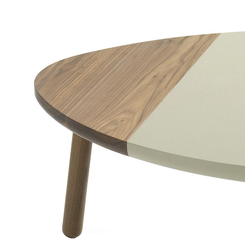 The top comprises two parts, one more reduced in solid wood like legs (walnut) and a bigger part made in MDF lacquered.