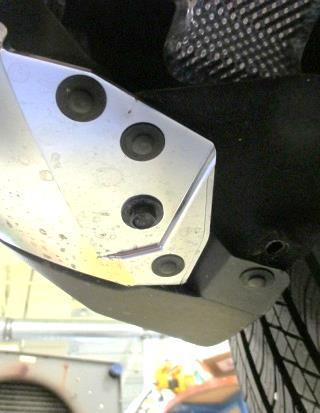 Use 10mm socket to remove (1) bolt each side which secures the exhaust hanger bracket and lower down the muffler. 2.