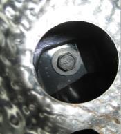 Heat shield loosening - use 8mm socket to remove (6) flange nuts which secure heat shield and rest the heat shield on muffler. Do not take the heat shield out of the vehicle. 4.