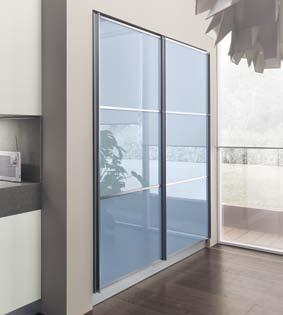 In the composition with Decorative Voile Larch, one of the available larder units has Aviation Blue polished glass sliding doors.