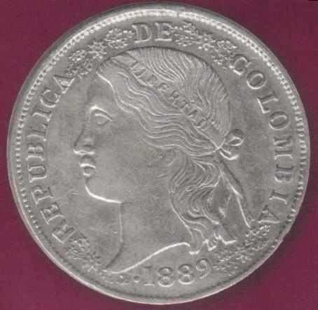 República de Colombia, 5 décimos, 1889 La segunda pieza mejor vendida fue el Lote No. 130. La descripción del catálogo es la siguiente: 50 c 1891 s Prueba en cobre 30 mm y 10,9 gr.