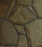 Piedra: Aplacado irregular compuesto por placas de piedra, tipo Santiago, rejuntados con junta de mortero gris de un centímetro.