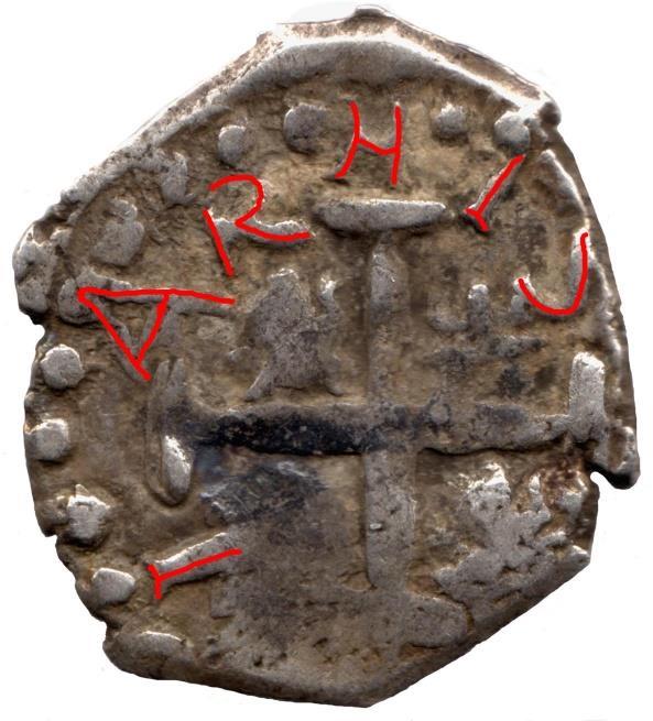 La leyenda en latín del reverso de las monedas de medio real dice: HISPANIARVM REX y luego aparece la fecha.