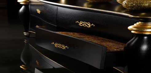 Gold Leaf details over black oak make the piece more gorgeous. Direct light on it enhances the beauty of the piece.