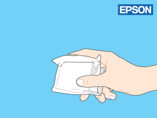 Saque el cartucho de tinta nuevo del embalaje. Precaución: Tenga cuidado de no romper los ganchos situados en el lateral del cartucho de tinta cuando lo saque del paquete.