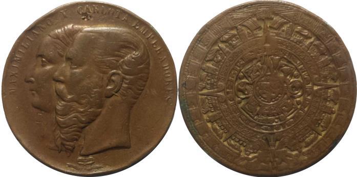 Lote 94: Maximiliano Y Carlota Emperadores, Reverso Con Calendario Azteca. 4 puntos de soldadura en canto como es usual en estas piezas que se cree fueron creadas para usarse como brazaletes.