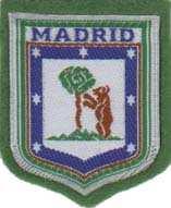 Escudo de Madrid, borde externo verde con letras y franja interna en azul, estrella en blanco,