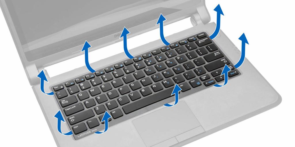 3. Extraiga el reborde del teclado del equipo. Instalación del reborde del teclado 1. Alinee el reborde del teclado en su sitio. 2. Presione por los lados del reborde del teclado hasta que encaje. 3.