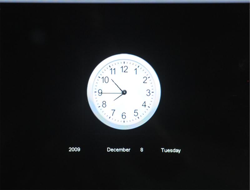 El marco puede mostrar una ventana auxiliar para la presentación de fotos, tal y como se muestra en la Figura 6, o bien puede uster traer un reloj