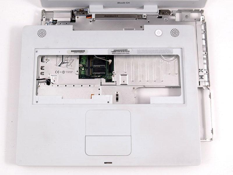Levante la caja superior y utilizar un spudger o el dedo para desconectar el conector del panel táctil escondida debajo de la lengüeta de plástico blanco.