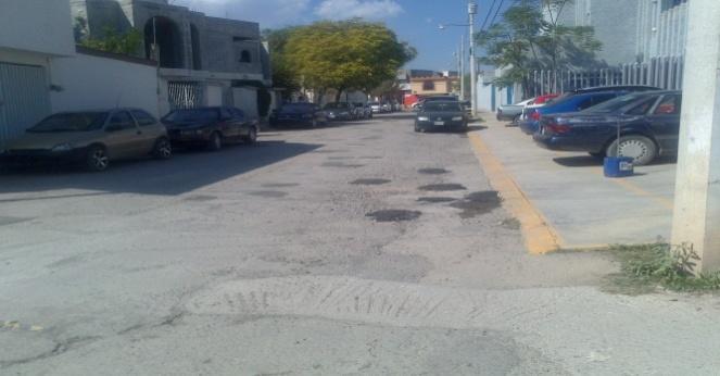 mezcla asfaltica y compactación) en la calle de SANTIAGO VIVANCO
