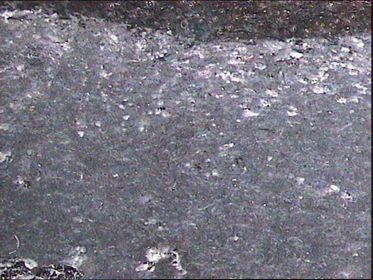 Resultados F Micrografía óptica (x10) de la muestra de algodón ensayada a flexión