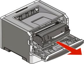 2 Levante y extraiga de la impresora la unidad que contiene el kit del fotoconductor y el cartucho de tóner. Coloque la unidad aparte en una superficie limpia y plana.