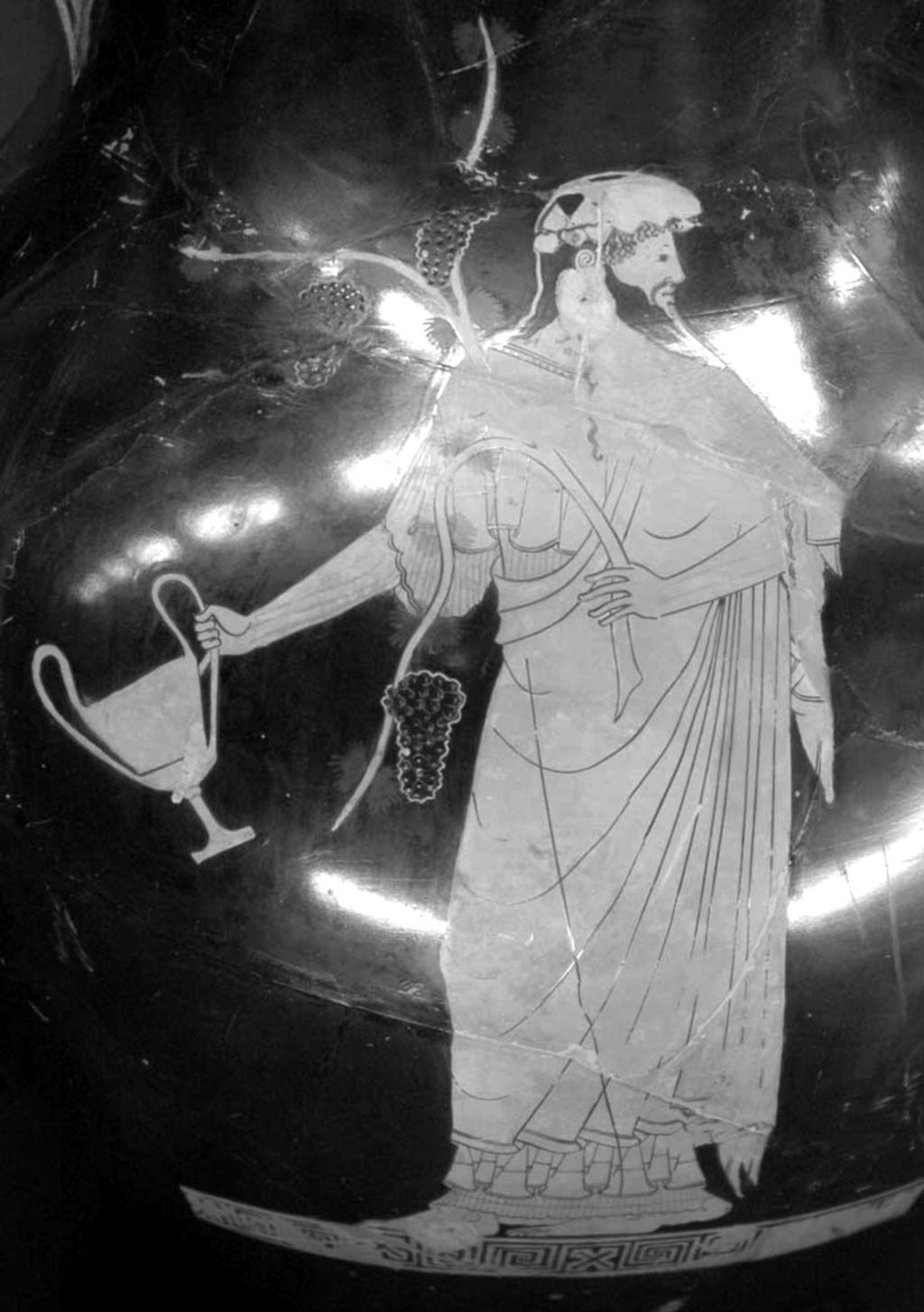 5. Exercici de cultura [2 punts] En la imatge següent es mostra el déu Dionís, en honor del qual se celebraven els festivals dramàtics grecs.