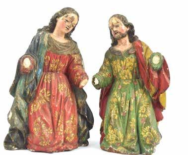 Par de tallas religiosas quiteñas para pesebre: San José y la Virgen María ; en madera tallada y policromada; detalles en oro; ojos en vidrio. Alto 23 cm.
